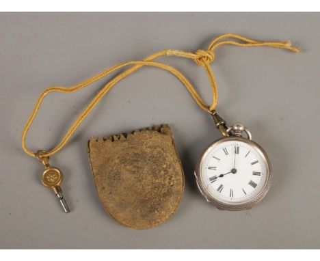 A silver fob watch, with white enamel dial bearing Roman Numeral markers. Inside of the case marked for G. Dobell, Hastings, 
