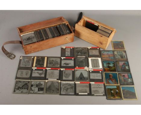 Two cases of magic lantern slides. Includes Holy War, Jack and the Beanstalk, buildings, military themes, etc.  Cases damaged