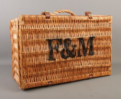 A Fortnum &amp; Mason wicker picnic hamper basket, with straw padding. Height: 34cm, Width: 51cm, Depth: 25cm.  