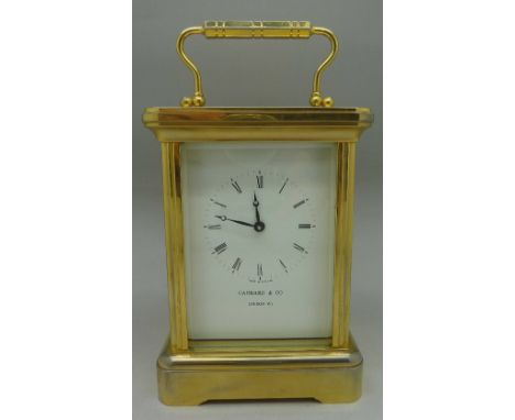 A brass and four glass sided mantel clock, the dial signed Garrard & Co. London W1, height of case 13.5cm