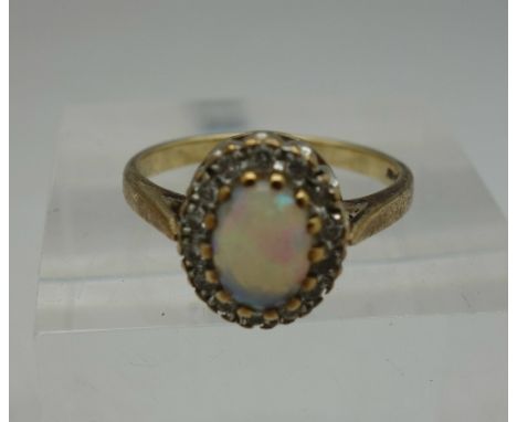 A 9ct gold, opal and white stone ring, weight 2.7g, size M