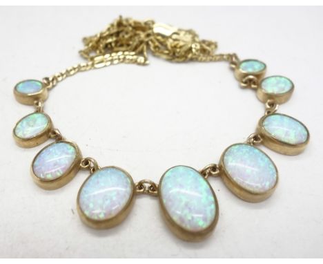A 9ct gold and synthetic opal set necklet, weight 14g