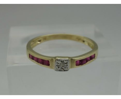 A 9ct gold, diamond and ruby ring, weight 1.1g, size N