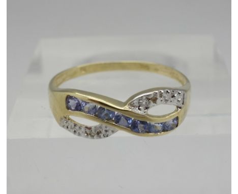 A 9ct gold, diamond and sapphire ring, weight 1.1g, size O