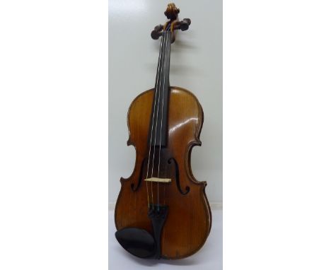 A violin, with paper label marked Manufactured in Dresden, Imitation of Antonius Stradivarius, length of back 36cm, cased