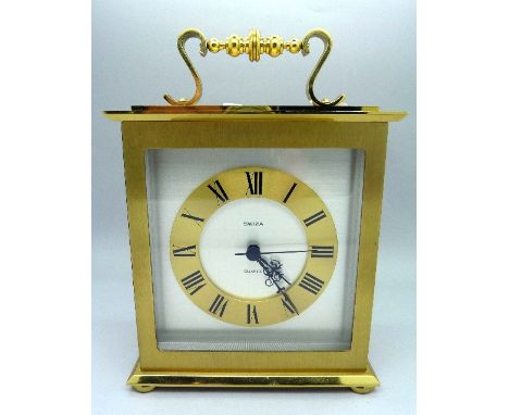 A Swiza brass cased mantel clock with quartz movement