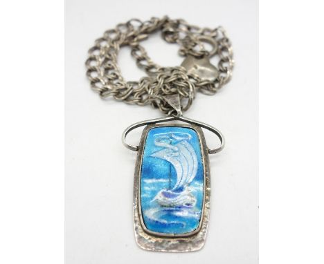 A silver chain with a white metal and enamel pendant with Viking ship