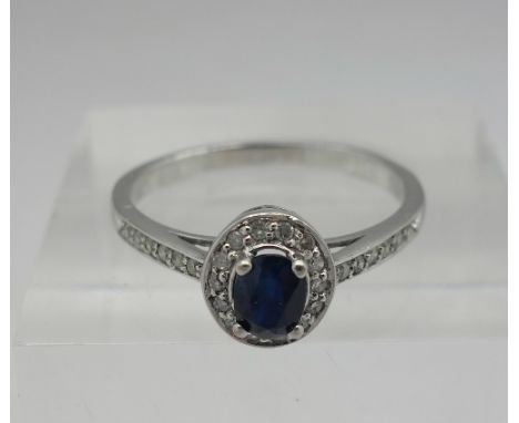 A 9ct white gold, diamond and sapphire ring, weight 1.8g, size N