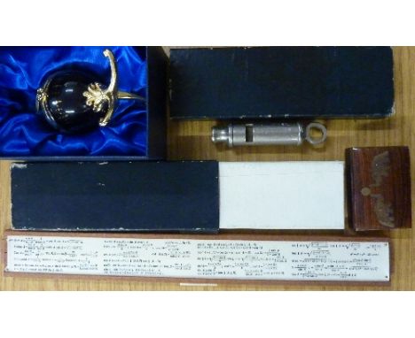 Two early 20th Century calendars, a Mayfair decorative egg, a military issue whistle and a snuff box