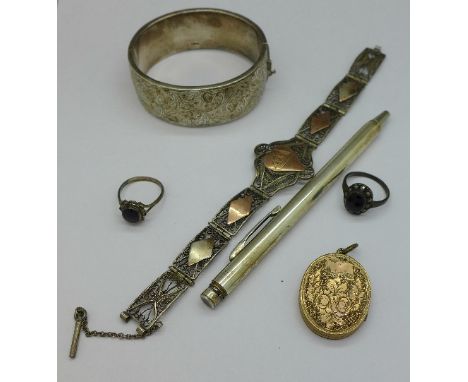 A silver bangle, a bracelet, two rings, a plated locket and a silver Eversharp pencil