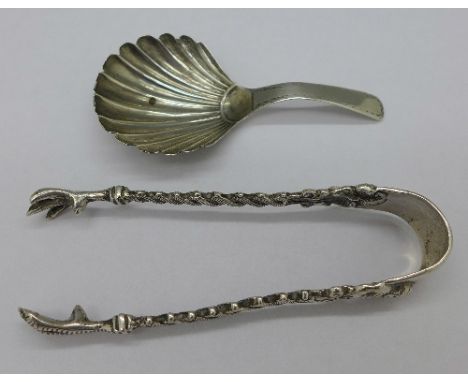 A Georgian silver caddy spoon by Joseph Taylor and a pair of silver sugar bows