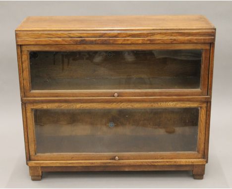 An oak two-tier Globe Wernicke stacking bookcase. 85 cm wide.
