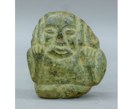 A Tribal Archaic boulder carved as a figure. 8.5 cm high.