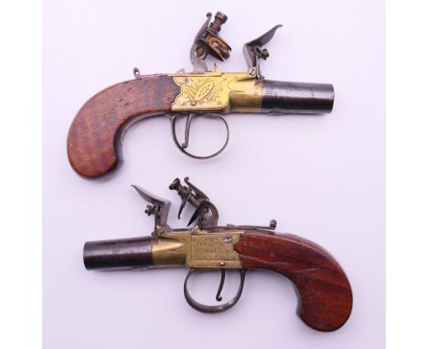 A pair of flintlock pocket pistols, each marked Drury & Wilde.  15.5 cm long. 