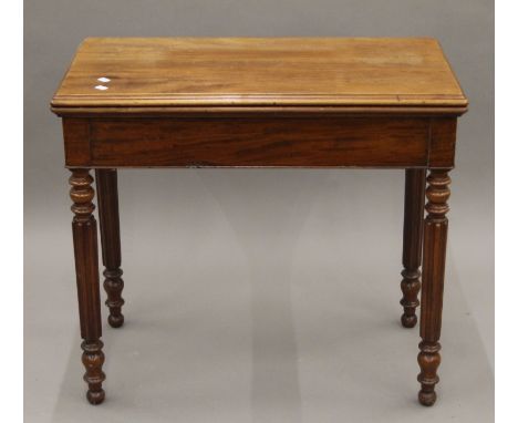 A 19th century mahogany card table and a mahogany drop-leaf table. The former 82 cm wide.