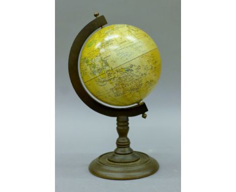 A globe. 31 cm high.