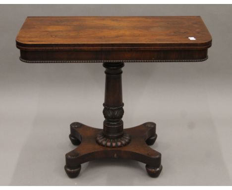 A Victorian rosewood folding card table. 91.5 cm wide.