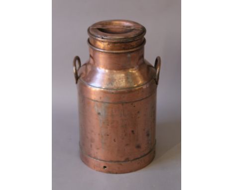 A vintage copper milk churn. 50 cm high.
