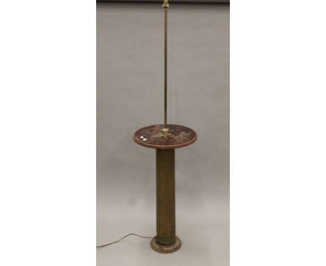 A brass and mahogany standard lamp. 165 cm high.