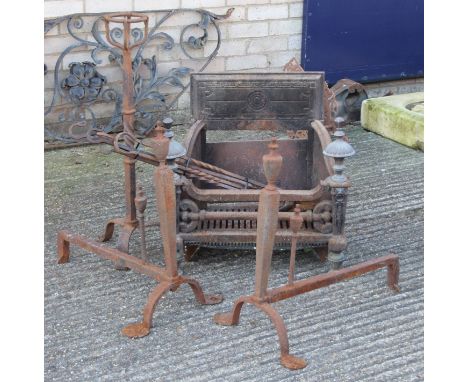 A 19th century cast iron fire grate, a pair of fire dogs and accessories. The former 60 cm wide.