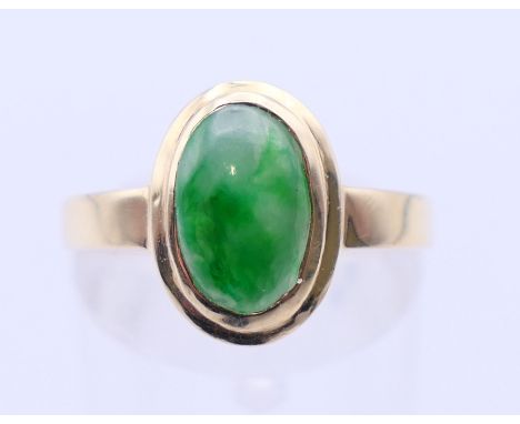 A  14 K gold and jade ring.  Ring size P/Q.