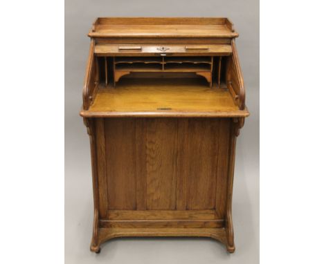 An early 20th century tambour-topped Lebus desk. 72 cm wide.