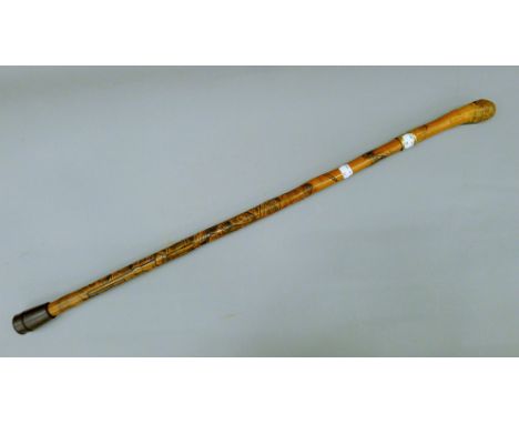 A Japanese carved bamboo sword stick (with broken blade). 84 cm high.