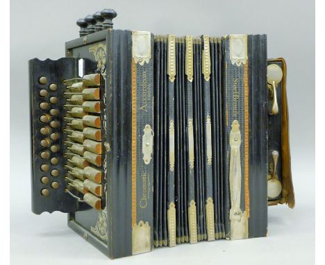 A vintage Chromatic accordion. 31 cm wide.