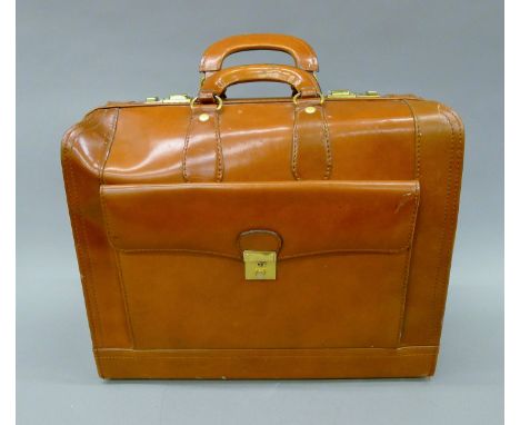 A leather briefcase with codes 458 and 900. 46 cm long.