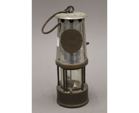 A vintage miner's lamp. 25 cm high.