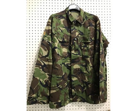 A COLLECTION OF BRITISH ARMY 'DPM' COMBAT WEAR. A collection of jackets and trousers, camouflage clothing including 'Jacket D