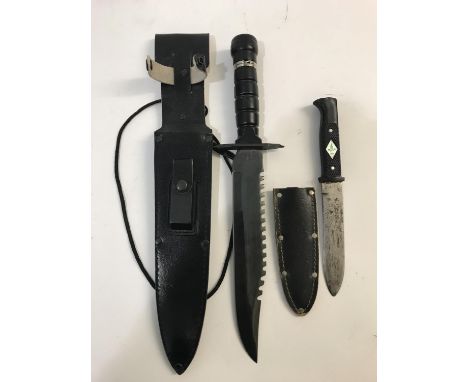 A MODERN HUNTING KNIFE AND ANOTHER. A modern divers or hunters knife with a saw backed blade stamped C.J.H. 104125, the handl