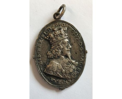 A CHARLES I ROYALIST BADGE BY T. RAWLINS. Charles I and Henrietta Maria Royalist badge, Obv. Crowned Bust, r, within script "