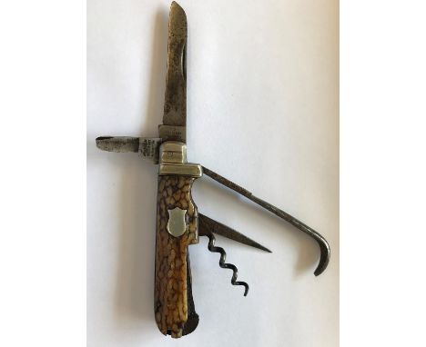 A FIVE BLADE HORSEMANS KNIFE BY HARRISON BROTHERS. A five blade folding horseman's knife, with horn grips, the blades marked 