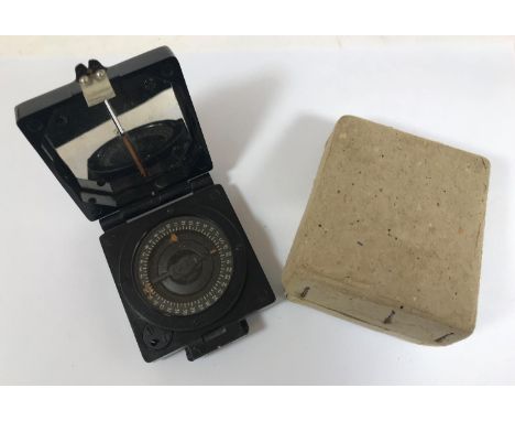 A SECOND WORLD WAR MILITARY COMPASS. A bakelite compass 'Compass Magnetic Marching Mark 1.' by T.G. Co Ltd, In original cardb