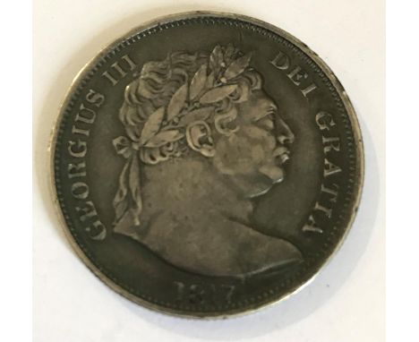 A GEORGE III HALFCROWN. A George III Hlafcrown, 'bulls head' portrait, dated 1817.