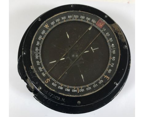 A SECOND WORLD WAR AEROPLANE COMPASS. A Type P8 compass with stamped No. 87309 H. 14cm wide.