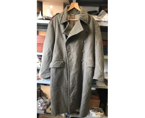 A RECENT YUGOSLAVIAN OR RUSSIAN GREATCOAT. A greatcoat, the epaulettes with twin red chevrons, and buttons with central raise