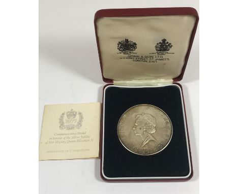 A QUEEN'S JUBILEE SILVER MEDAL BY LESLIE DURBIN FOR SPINK. A silver medal by Leslie Durbin, the obverse with a portrait of Qu