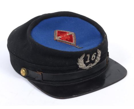 AN AMERICAN KEPI TYPE CAP. An American Blue and black wool Kepi by M.C. Lilley &amp; Co. Manufacturers of Military Goods, Col