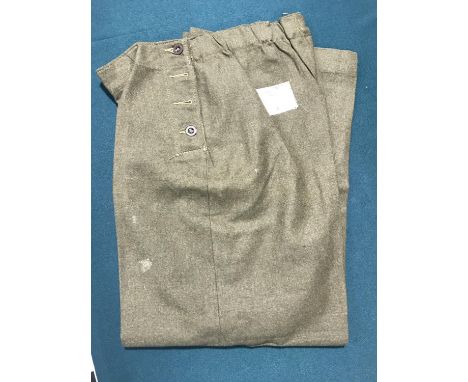 A COLLECTION OF MILITARY UNIFORM. A large collection of R.A.F. and Army workshirts, battledress trousers, slacks A.T.S. size 