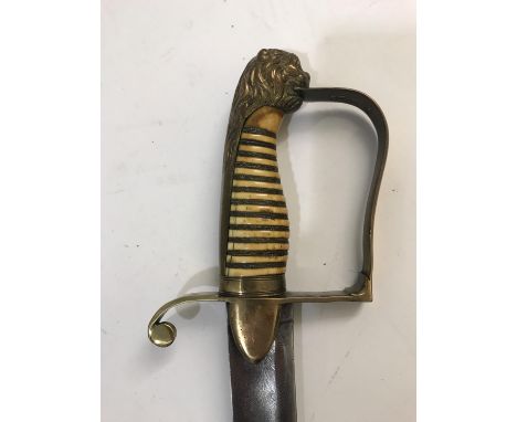 A YEOMANRY CAVALRY OFFICER'S SWORD C.1800. An early 19th century Yeomanry Cavalry Officer's Sword with a curved blade with fu