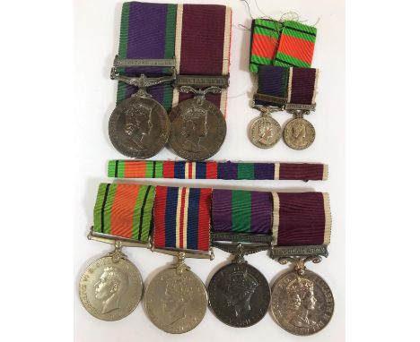 A SECOND WORLD WAR AND POST WAR FAMILY GROUP OF FOUR AND TWO. A group of four comprising Defence Medal and War Medal, General