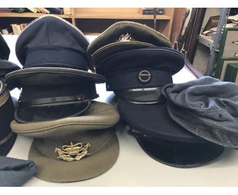A COLLECTION OF MILITARY CAPS, BERETS AND HATS. A collection of military hats including Navy, Army and Airforce examples, som