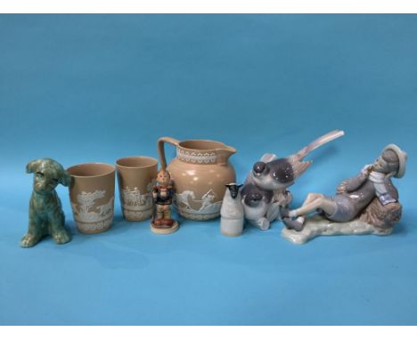 Two Lladro figures, a Hummel figure and a water jug and two beakers etc.