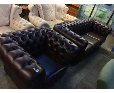 A brown leather Chesterfield three seater sofa and matching Club chair