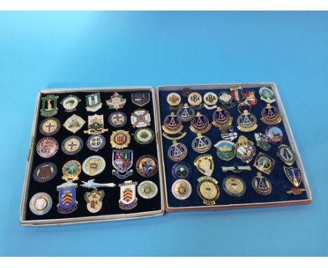 A collection of enamel badges