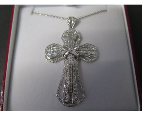 An 18ct white gold designer cross approx 2.75ct of diamonds, carat weight marked to the suspension loop - approx size includi