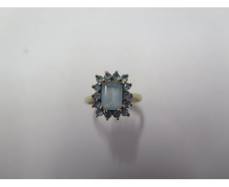 A hallmarked 9ct yellow gold aquamarine cluster ring - head approx 10mm x 12mm, ring size J - approx weight 2.4 grams 