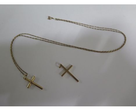 A 18ct yellow gold crucifix on a 78cm no clasp chain - approx weight 7.7 grams - and a 9ct crucifix approx weight 2.6 grams 